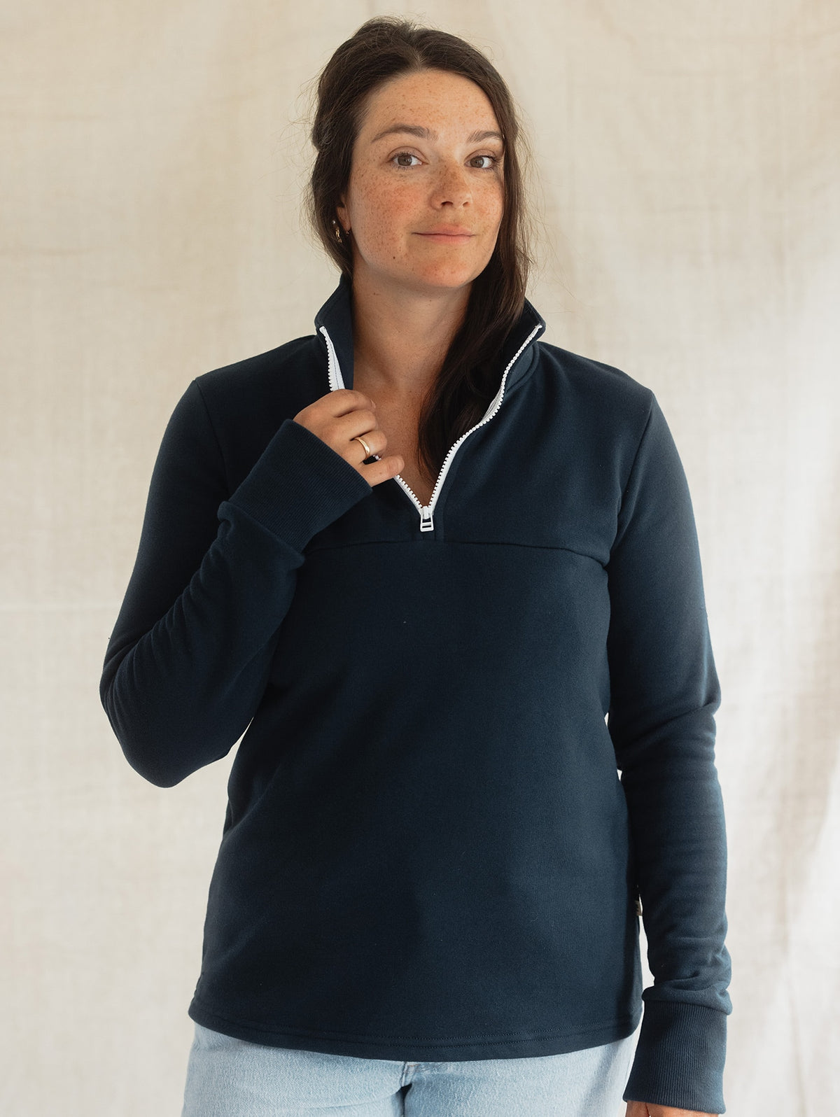 Woman wearing the navy Mountaineer Sweater from Blondie Apparel