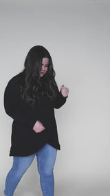 video showing off blondie apparel crossfront sweater in black