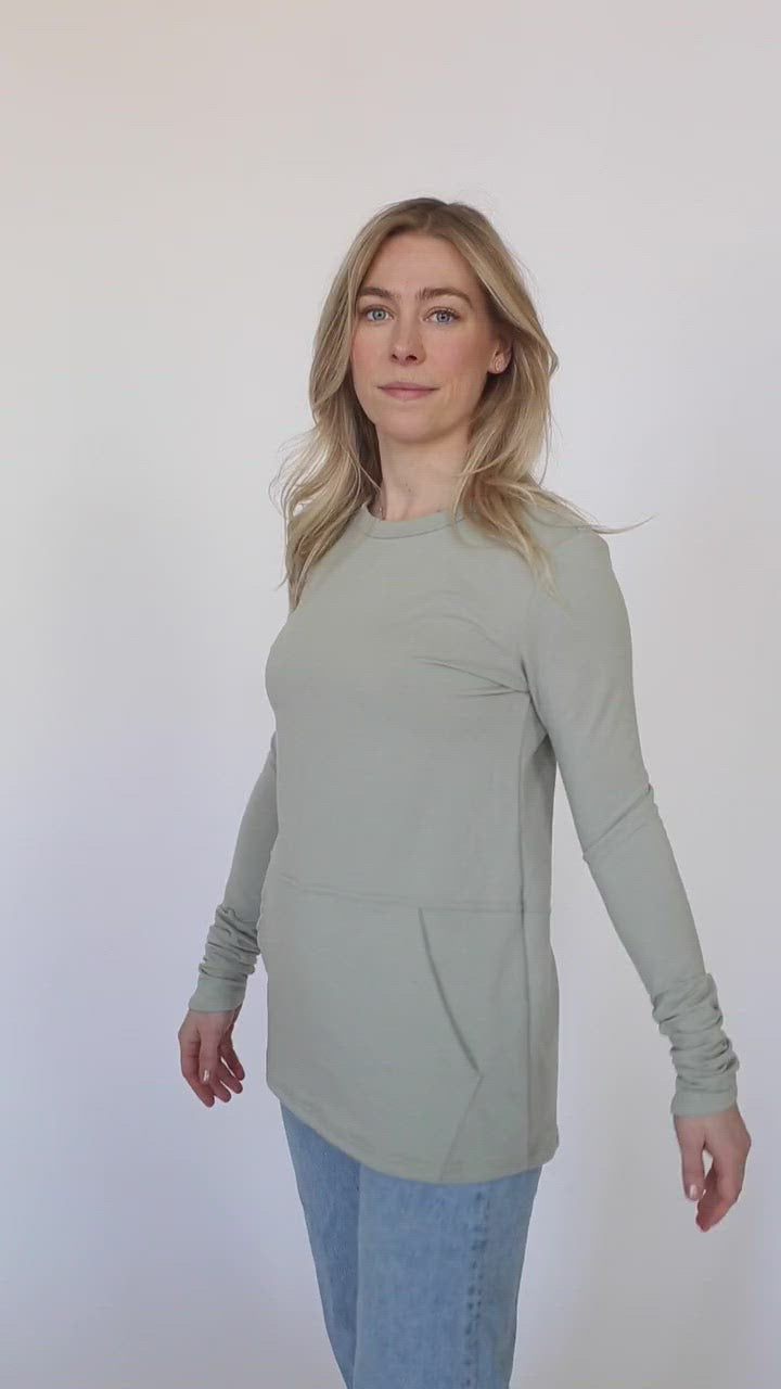 Video of woman wearing the light sage hillside sweater